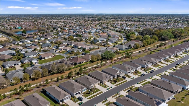 aerial view featuring a residential view and a water view