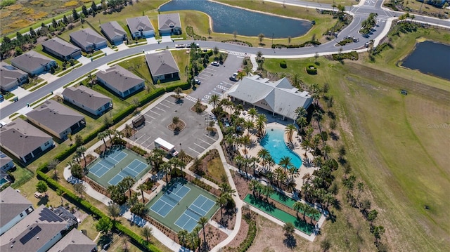 drone / aerial view with a residential view and a water view