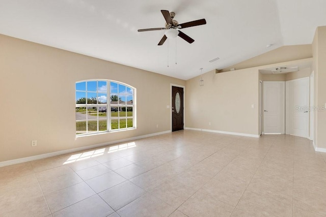 unfurnished room featuring baseboards, lofted ceiling, and ceiling fan