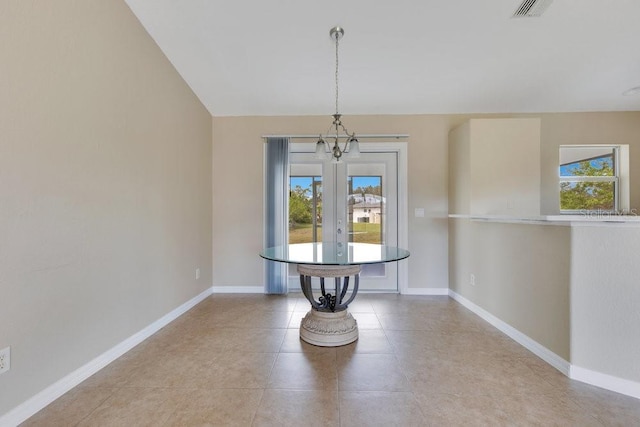 unfurnished dining area with an inviting chandelier, light tile patterned flooring, baseboards, and visible vents