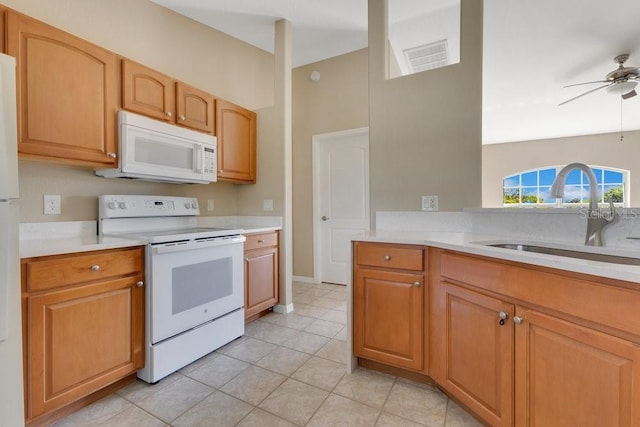 kitchen with white appliances, visible vents, ceiling fan, a sink, and light countertops