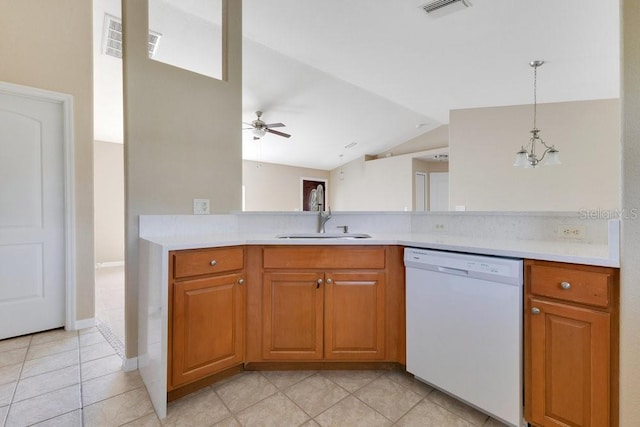 kitchen with dishwasher, light countertops, visible vents, and a sink