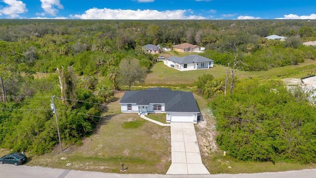 aerial view with a wooded view