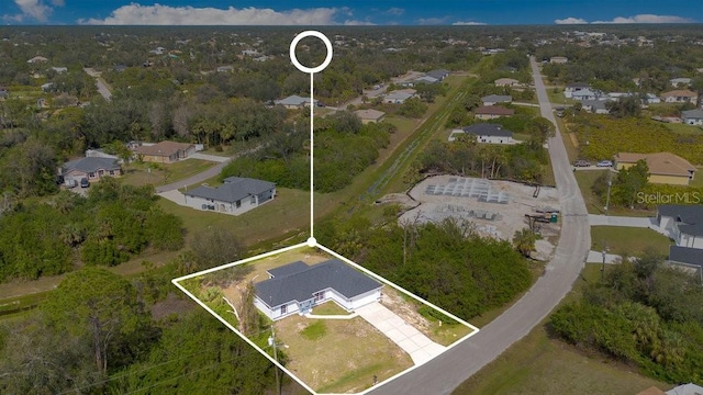 birds eye view of property with a residential view