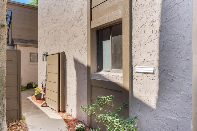 doorway to property with stucco siding