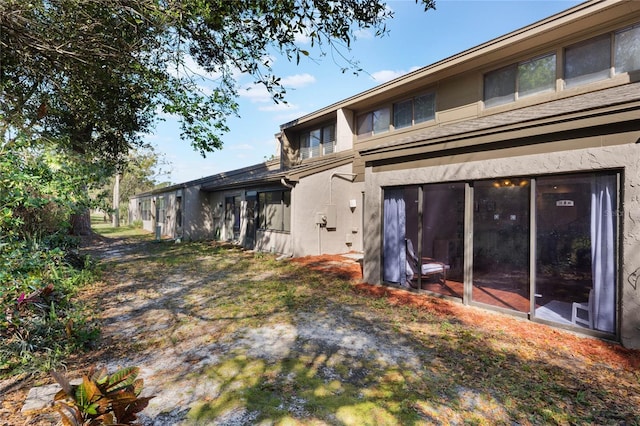 back of property with stucco siding