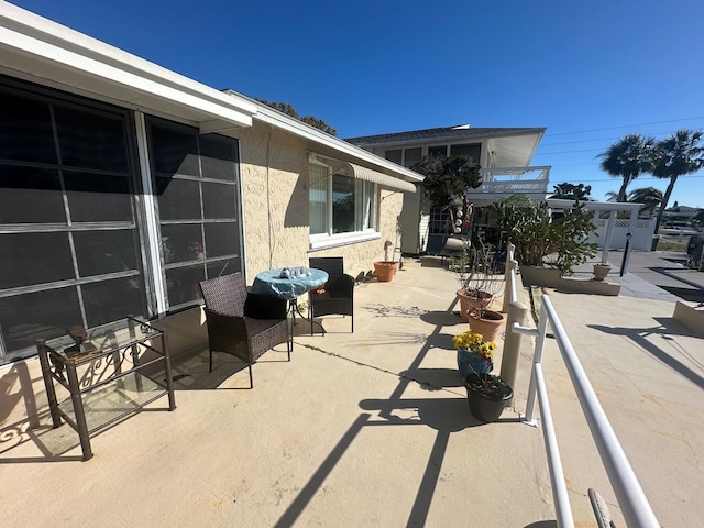 view of patio / terrace with a balcony