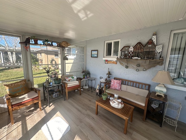 sunroom / solarium with plenty of natural light and wooden ceiling