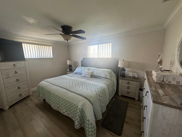 bedroom featuring multiple windows, light wood-style floors, and ornamental molding