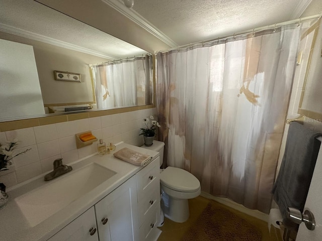 full bathroom with vanity, a textured ceiling, crown molding, toilet, and tile walls