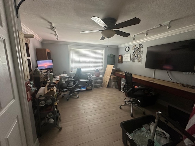 office area featuring a ceiling fan, a textured ceiling, wood finished floors, rail lighting, and crown molding