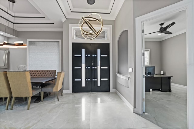 foyer entrance with a tray ceiling, baseboards, marble finish floor, and ornamental molding