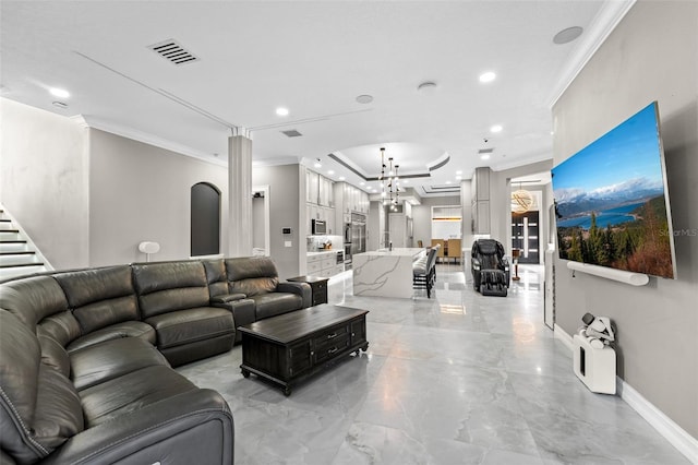 living area featuring baseboards, visible vents, recessed lighting, ornamental molding, and a chandelier