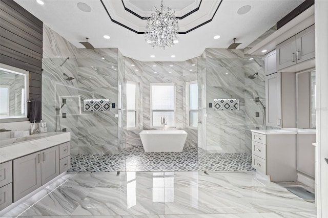 bathroom with a marble finish shower, ornamental molding, two vanities, marble finish floor, and a raised ceiling