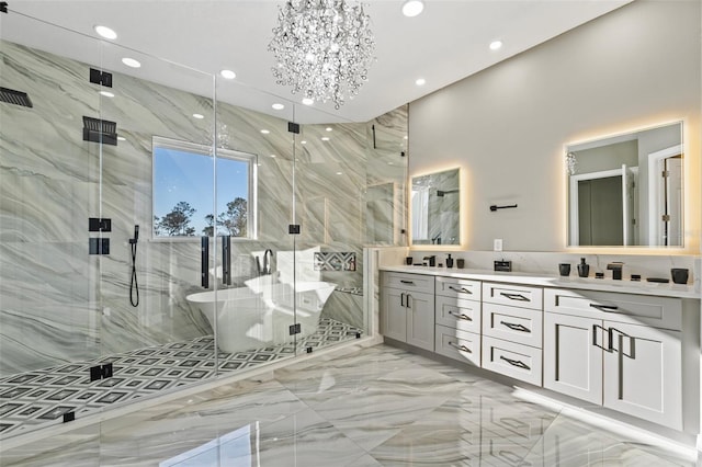 full bathroom with a freestanding tub, marble finish floor, recessed lighting, a marble finish shower, and double vanity