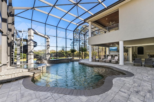 view of pool featuring a ceiling fan, an outdoor living space, a patio, glass enclosure, and stairs