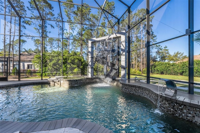 view of pool featuring a lanai, a patio area, and a pool with connected hot tub