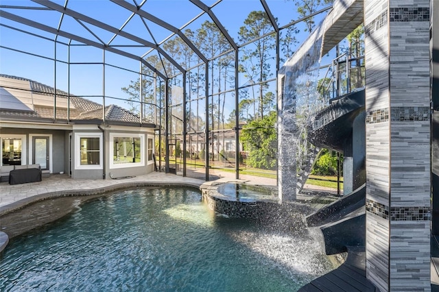 view of pool featuring a lanai, a patio area, and an outdoor living space