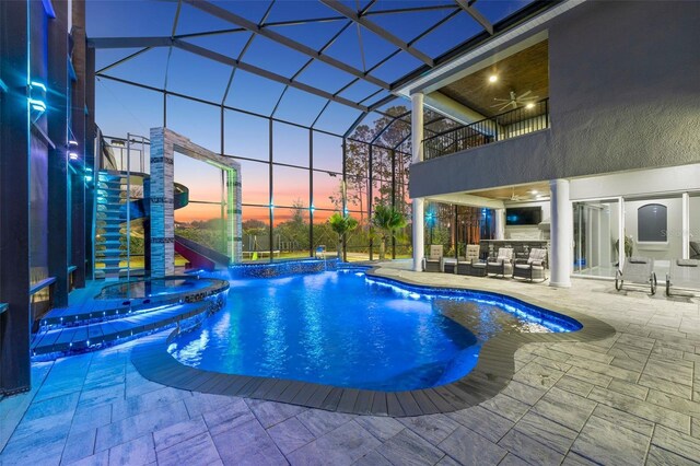 pool featuring ceiling fan, a patio, a lanai, and an outdoor hangout area