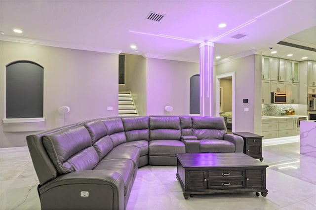 living room with recessed lighting, visible vents, and ornamental molding