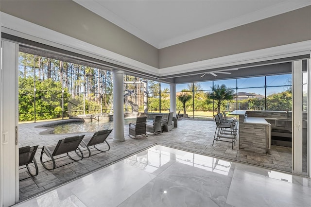 4205 Clarice Ct, Windermere, FL 34786 - sunroom with outdoor wet bar, area for grilling, and a ceiling fan