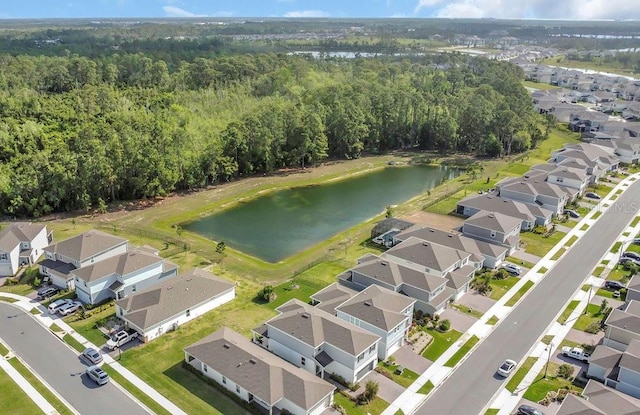 bird's eye view with a water view, a residential view, and a forest view