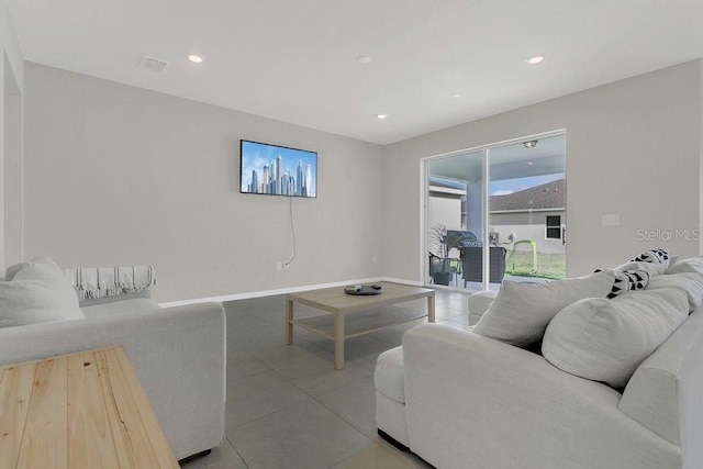 living room with visible vents, baseboards, recessed lighting, and light tile patterned flooring