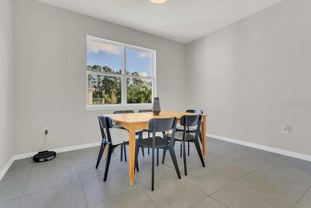tiled dining space with baseboards