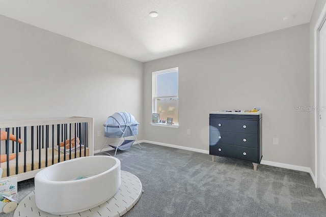 bedroom with carpet floors and baseboards