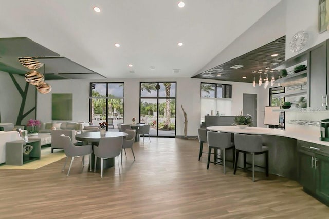 dining space featuring light wood-type flooring, visible vents, and recessed lighting