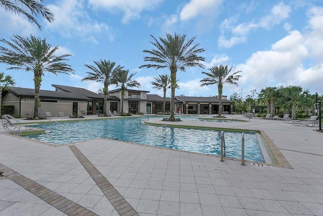 community pool with a patio area