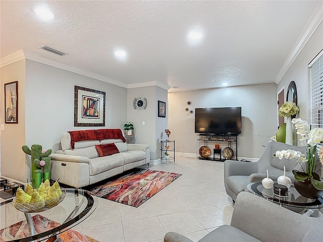 living room featuring light tile patterned floors, visible vents, a textured ceiling, and crown molding