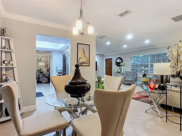 dining room with light tile patterned floors, a chandelier, visible vents, and ornamental molding