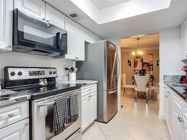 kitchen with white cabinetry, light tile patterned floors, visible vents, and stainless steel appliances