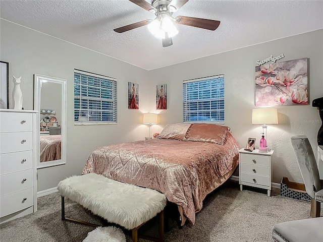 bedroom with baseboards, ceiling fan, a textured ceiling, and carpet