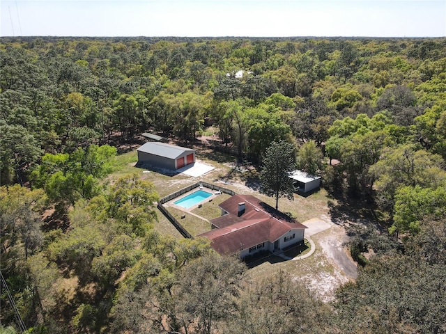 aerial view featuring a wooded view