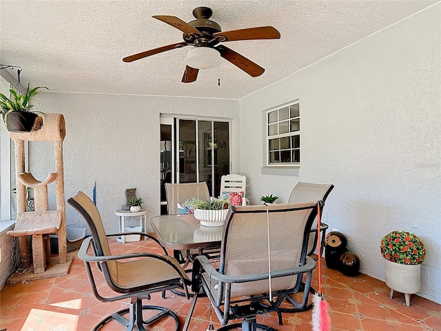 view of patio featuring outdoor dining space and ceiling fan