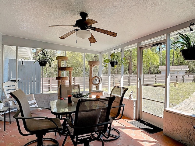 sunroom / solarium with ceiling fan