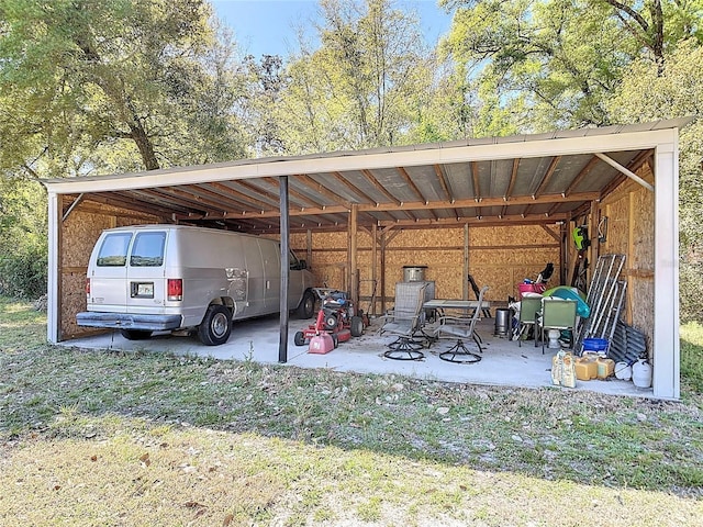 view of parking / parking lot with a carport