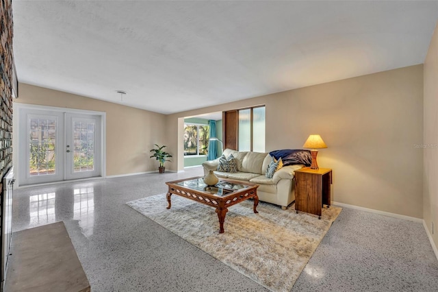 living room with french doors and baseboards