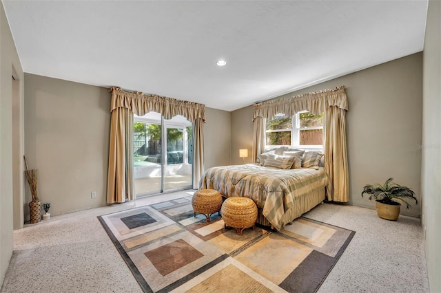 bedroom featuring recessed lighting, speckled floor, and access to exterior