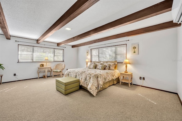 bedroom with beamed ceiling, baseboards, a textured ceiling, and carpet flooring