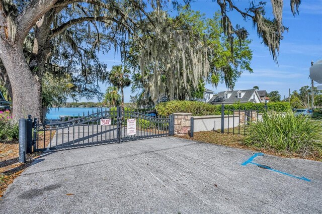 view of gate featuring a water view