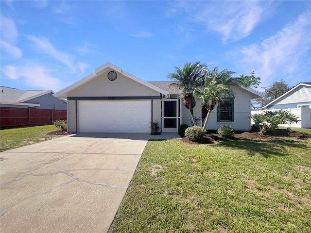 ranch-style home with an attached garage, concrete driveway, a front yard, and fence