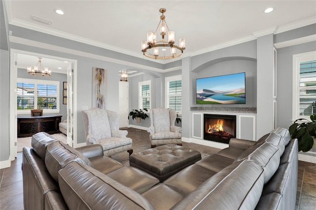 tiled living area with ornamental molding, baseboards, a warm lit fireplace, and a chandelier