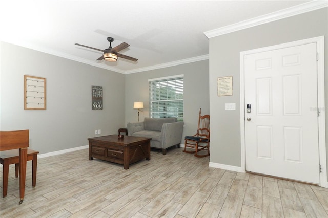 living area featuring crown molding, light wood finished floors, and ceiling fan