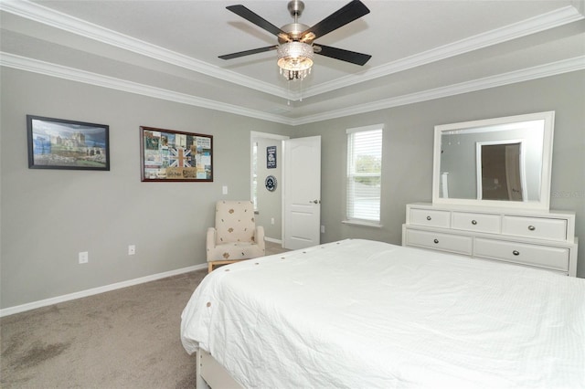 bedroom with carpet flooring, ceiling fan, crown molding, and baseboards