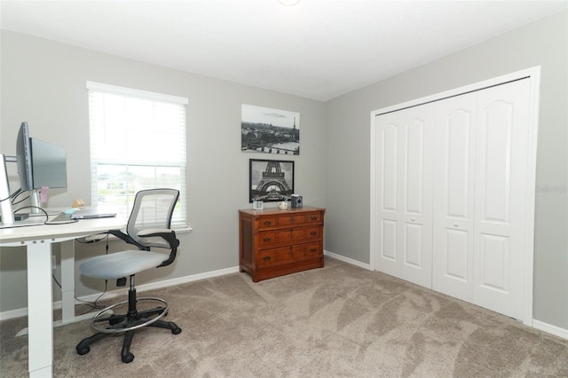 home office with baseboards and carpet floors