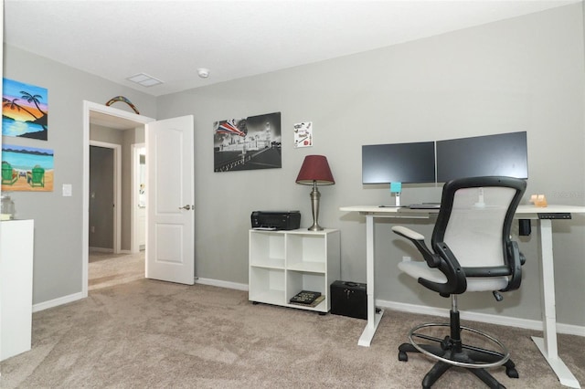 carpeted home office with visible vents and baseboards