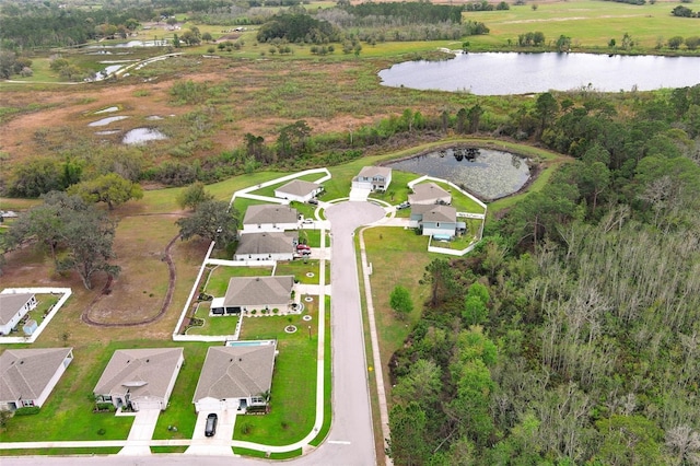 birds eye view of property with a water view and a residential view